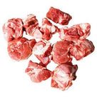 Fresh raw mutton rezala cut pieces with white fat on a white background