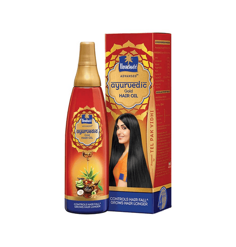 Parachute Ayurvedic Gold Hair Oil bottle and box with long black hair woman, controls hair fall, grows hair longer