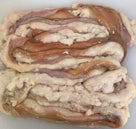 Raw pork intestines with visible fat layers on a white surface, fresh offal for cooking